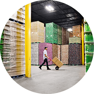 man with dolly in warehouse