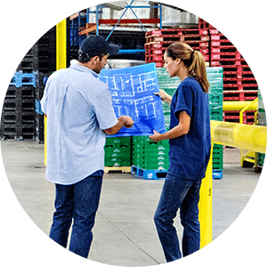 man and woman looking at blueprint